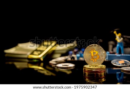 Bitcoin of Crypto currency with gold, money and miniature toy. New virtual of technology and business for block chain