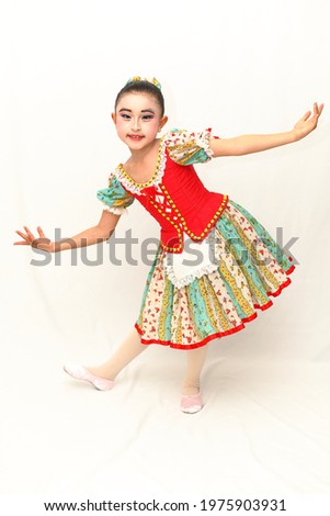 Girl dancing in red costume