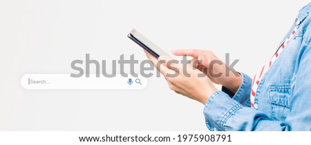 Search Engine Optimization - SEO concept. Closeup of a female's hands using a smartphone with search bar graphic beside. Machine learning, AI Artificial intelligence, Smart search, Keyword research. Royalty-Free Stock Photo #1975908791