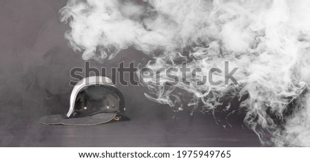 Vintage leather fireman helmet, isolated on black