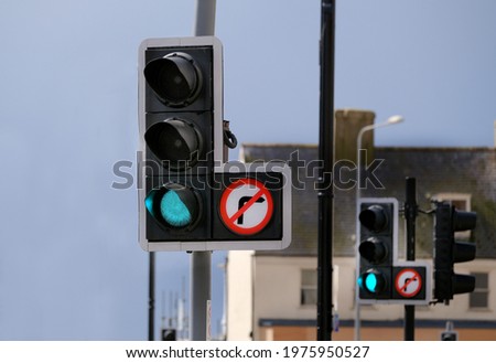 Traffic control lights at busy town junction. UK.