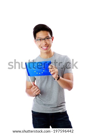 Happy young asian man holding flag of europe union over white background