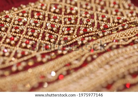 handcrafted intricate aari and chumki work in a silk fabric Royalty-Free Stock Photo #1975977146