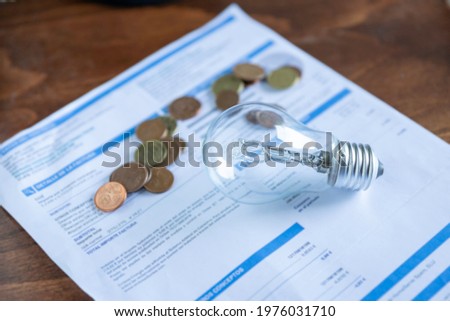 Light bill with light bulb.
Conceptual about the price of electricity and paying taxes Royalty-Free Stock Photo #1976031710