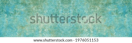 Old blue green vintage shabby patchwork damask ornate motif tiles stone concrete cement wall wallpaper texture background banner panorama long	
