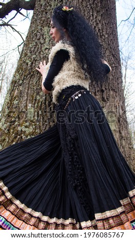 woman in traditional indian skirt on forest background

