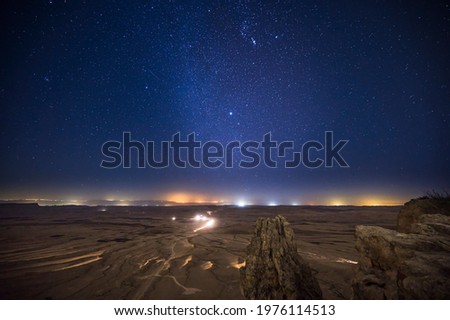 Starry night with Geminids meteor shower over Makhtesh Ramon - the Ramon Crater, Negev Desert, Israel Royalty-Free Stock Photo #1976114513
