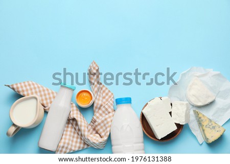 Different dairy products without lactose on color background Royalty-Free Stock Photo #1976131388
