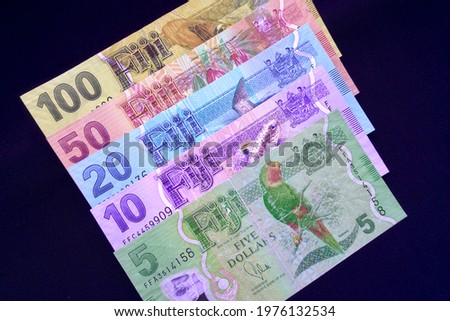 The Fijian dollar (currency sign: FJ$, $; currency code: FJD) is the currency of Fiji. Colorful money notes featuring flora and fauna, Fijian places and industries. $5, $10, $20, $50, $100.