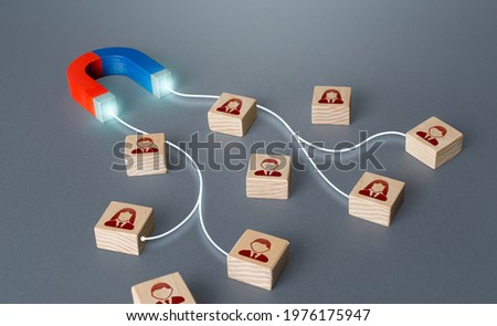 Magnet selectively attracts people. Hiring highly qualified professional staff. Finding best talented candidate. Human resources. Marketing and targeting. Optimal choice. Big data operating Royalty-Free Stock Photo #1976175947