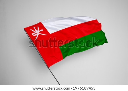 Oman flag isolated on white background with clipping path. close up waving flag of Oman. flag symbols of Oman. Oman flag frame with empty space for your text.