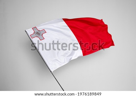 Malta flag isolated on white background with clipping path. close up waving flag of Malta. flag symbols of Malta. Malta flag frame with empty space for your text. Royalty-Free Stock Photo #1976189849
