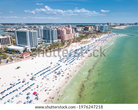 Summer vacations in Florida. Panorama of Ocean beach and Resorts in US. Blue-turquoise color of water. American Coast or shore. Island in Gulf of Mexico. Clearwater Beach FL. Aerial view on city