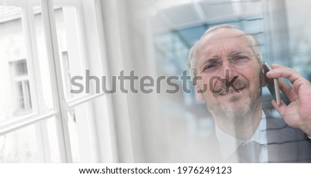 Composition of smiling businessman talking on smartphone in office with double exposure. global business, communication and success concept digitally generated image.