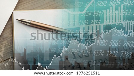 Composition of financial statistics processing and notepad with pen in background. global business, technology and digital interface concept digitally generated image.