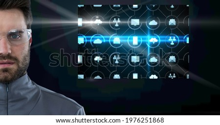 Composition of man with productivity digital icons on screen. global technology and digital interface concept digitally generated image.