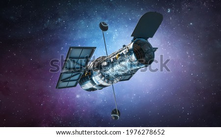 Space telescope Hubble in bright outer space. Milky way and galaxy with stars research. Elements of this image furnished by NASA Royalty-Free Stock Photo #1976278652