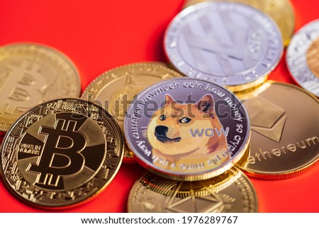 Dogecoin DOGE group included with Cryptocurrency coin bitcoin, Ethereum ETH, Bitcoin Cash bch, Ethereum Classic ETC symbol Virtual blockchain technology future is money lose Close up on red background Royalty-Free Stock Photo #1976289767