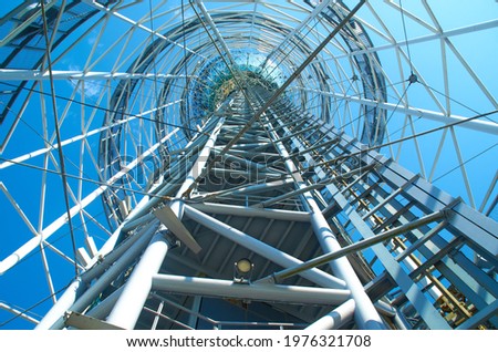 Spiral geometry of metal metallic construction tower. 