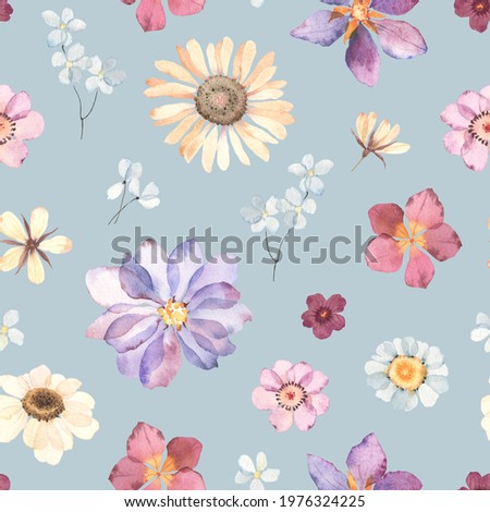 Floral watercolor seamless pattern with colorful flowers in herbarium style. Hand painting image, print in pastel colors on blue background.