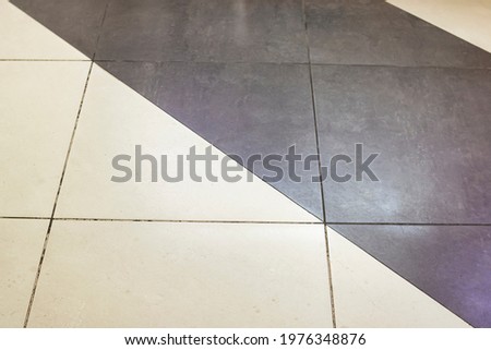 Gray floor tiles close up, background or texture
