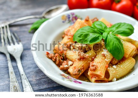  Pasta bolognese .Italian home made meal Fresh   maccheroni pasta with tomato sauce, basil, herbs ,parmesan cheese ,fresh cherry tomatoes and parsley on wooden background. Kitchen Poster 