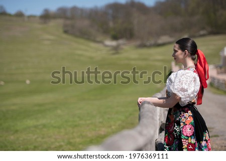 Young beautiful slovak girl in traditional dress. Slovak folklore
