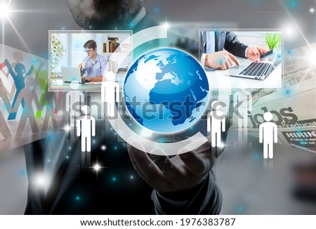 Global network concept. Hand holding hologram of planet earth and screens.