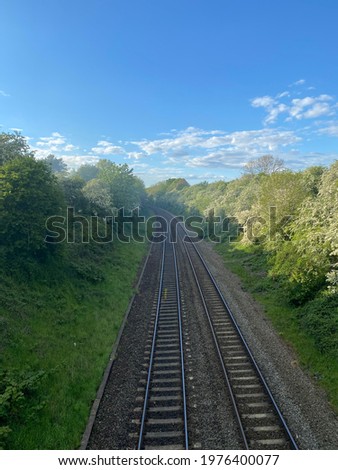 A smoke from a garden fire passes the railway