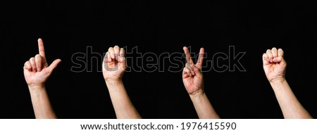 Word Love made with hand gesturing international sign language signs rainbow flag gay pride on black background
