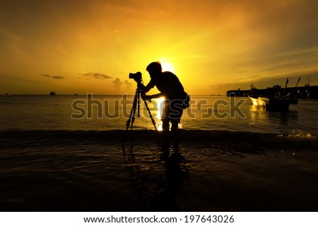 Silhouette of Seascape Photographer Takes a good shot, Sunrise. HuaHin Thailand