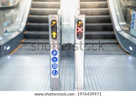 Escalator in modern building with the do not sign while use the escalator  no passenger that convenience for pull and push the luggage suitcase go to the counter check-in at the airport.