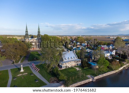 View on the Saint Denis sur Richelieu rivier, Church and farms, Quebec, Canada  Royalty-Free Stock Photo #1976461682