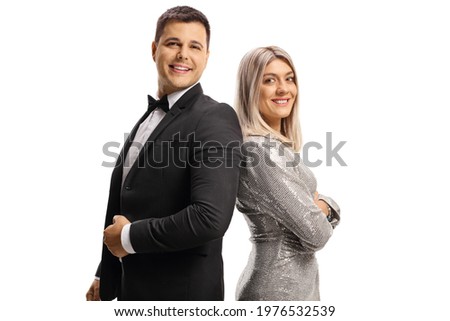 Elegant man and woman posing back to back isolated on white background