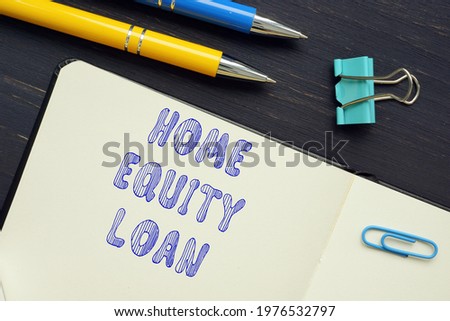 Business concept meaning HOME EQUITY LOAN with phrase on the piece of paper. 
