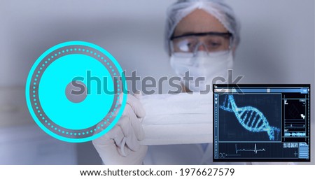 Composition of scope and screen with dna over doctor in ppe suit holding face mask. global covid 19 pandemic, medicine, digital interface and data processing concept digitally generated image.