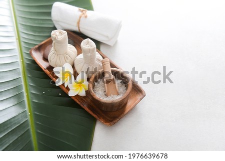 SPA concept: composition of spa treatment on green leaf background with copy space 

