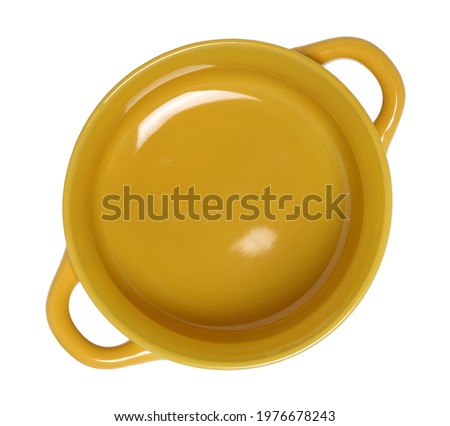 Clay pot or ceramic plate with handles isolated on white background, plate for porridge, salad and other dishes. Top view. Royalty-Free Stock Photo #1976678243