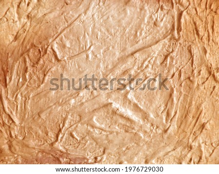 Abstract brown background from brush strokes of oil paint. Long streaks of paint.