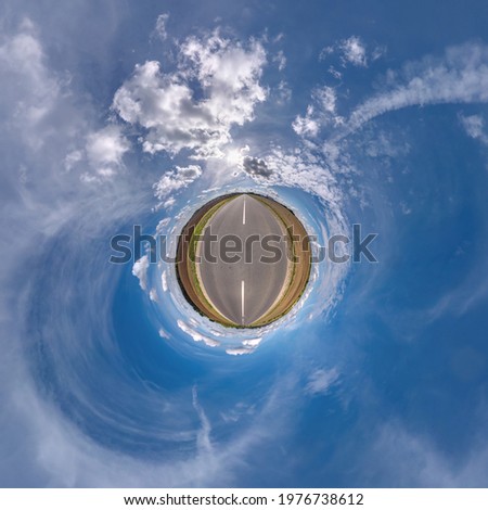 tiny planet in blue sky with beautiful clouds. Transformation of spherical panorama 360 degrees. Spherical abstract aerial view. Curvature of space.