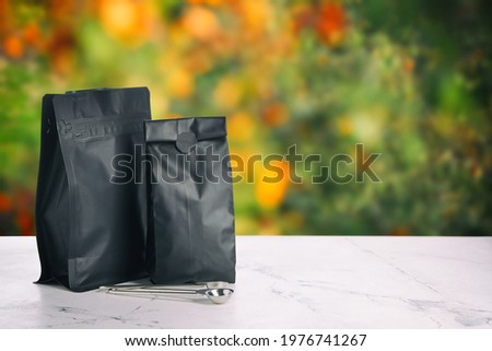 Paper bags for coffee on table outdoors