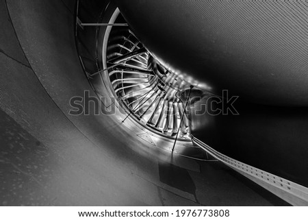 A look at the inside of a jet engine. black and white edit Royalty-Free Stock Photo #1976773808