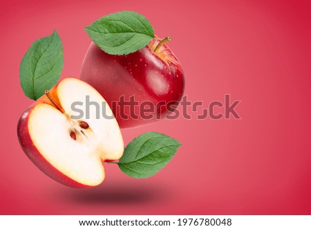 Fresh Red Apple with leaf isolated on red colour background, Red Royal Gala apple on red background With clipping path.