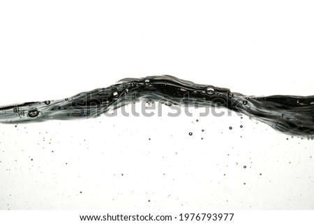 Water waves create bubbles floating in the clear water. Isolated on white background. In summer 