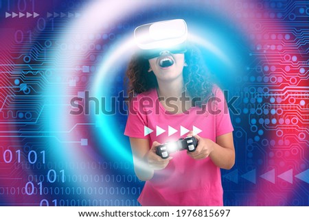 Young African-American woman with VR glasses playing video games on color background