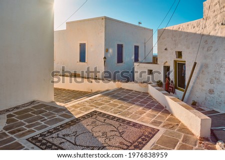 Greek village typical street view with whitewashed houses. Plaka town, Milos island, Greece