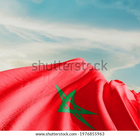 Morocco waving flag in the sky. Royalty-Free Stock Photo #1976855963