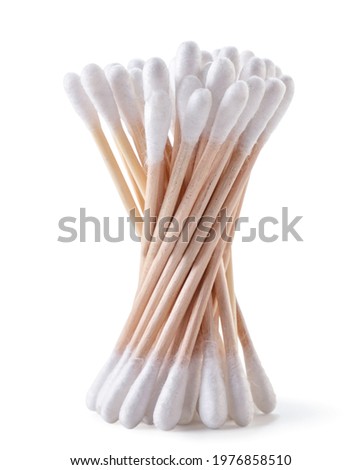 Cotton swabs on a wooden base for the ears close-up on a white background. Isolated Royalty-Free Stock Photo #1976858510