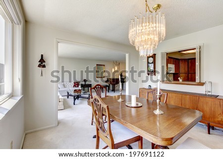 Dining room with rustic table set decorated with candles.
