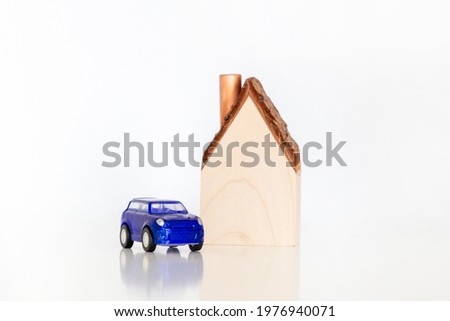 Model of a private house with a parked car